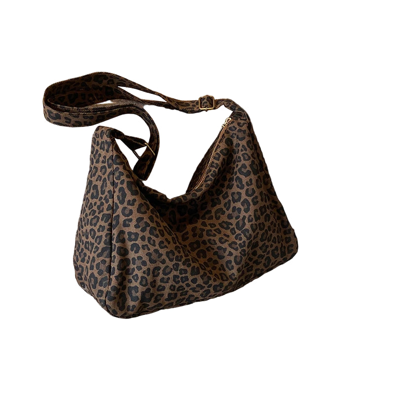 Bolsa transversal feminina moderna, casual, em tecido macio, com estampa de leopardo e grande capacidade. Ideal para o dia a dia e passeios.